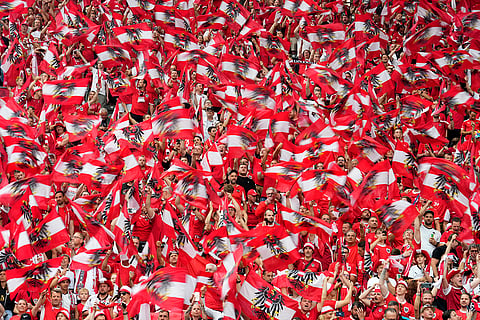 Austrian fans cheer for their team